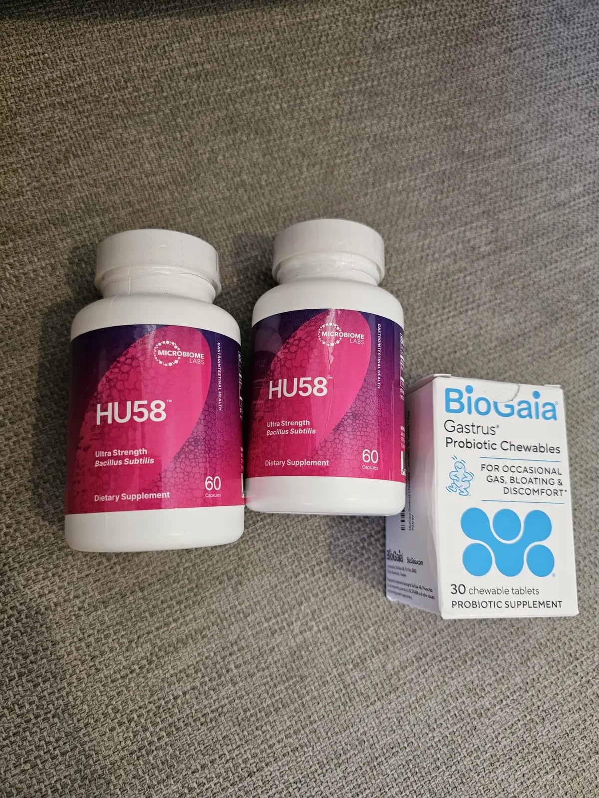 Two bottles of HU58 B. subtilis beside a box of BioGaia Gastrus